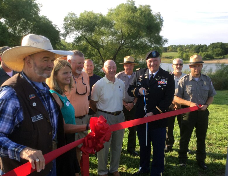 Lt. Col. Brent Legreid, deputy commander, Kansas City District, U.S. Army Corps of Engineers, joined local, state and federal officials to cut the ribbon rededicating the Milford Lake Dam on its 50th anniversary August 12, 2017.