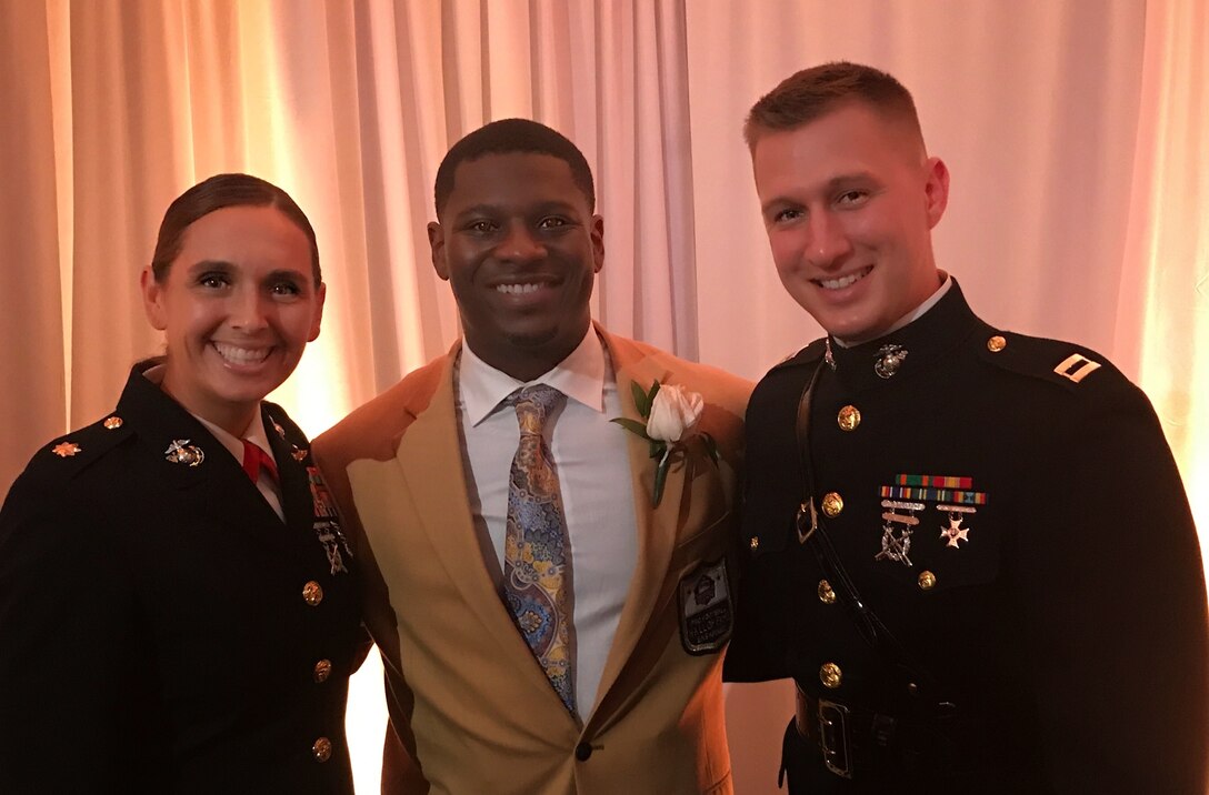 Major Ruth Kehoe, commanding officer of Recruiting Station Dallas, and Captain Samuel Wetselaar, operations officer, pose with LaDainian Tomlinson following his induction into the Pro Football Hall of Fame August 5, 2017, in Canton, Ohio. In collaboration with Marine Corps Recruiting Command, 8th Marine Corps District is partnering with LaDainian Tomlinson’s Touching Lives Foundation as part of the growing City Partnership Program between the district and the city of Dallas. The Foundation enhances the lives of deserving families in the Dallas-Fort Worth area by promoting educational, social and cultural awareness. (Courtesy Photo)
