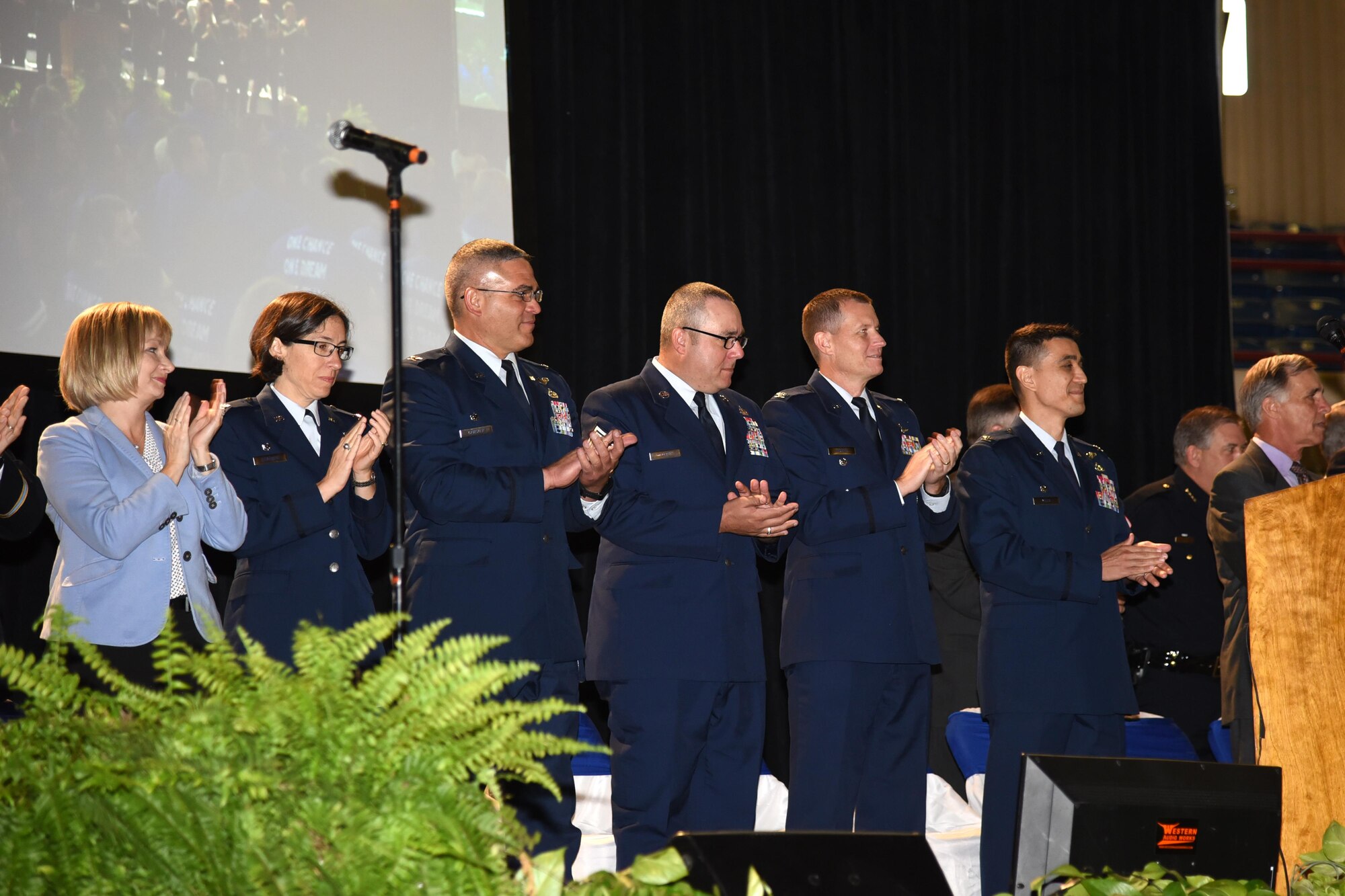 Toni Hansen, 17th Mission Support Group deputy director, U.S. Air Force Col. Janet Urbanski, 17th Medical Group commander, Col. Alex Ganster, 17th Training Group commander, Chief Master Sgt. Daniel Stein, 17th Training Group superintendent, Col. Jeffrey Sorrell, 17th Training Wing vice commander and Col. Ricky Mills, 17th Training Wing commander are welcomed as guests of honor to the San Angelo Independent School District annual convocation signifying the kickoff of the 2017-2018 school year at the Foster Communications Colosseum, San Angelo, Texas, Aug. 15, 2017.