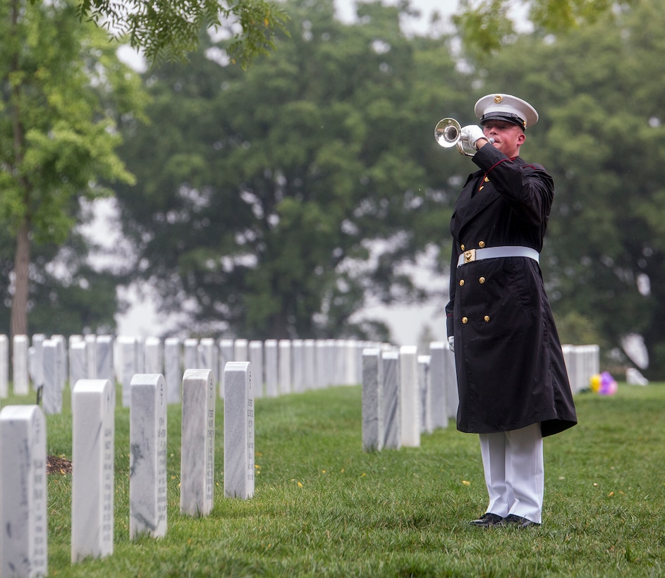 A bugler with “The Commandant’s Own” U.S. Marine Drum & Bugle Corps plays Taps following the three-volley salute during a funeral for Marine Sgt. Joseph J. Murray at Arlington National Cemetery, Arlington, Va., Aug. 15, 2017. Murray, 26, was one of the 15 Marines and one Navy sailor who perished when their KC130-T Hercules crashed in Mississippi, July 10, 2017. Murray was a Critical Skills Operator with the 2nd Raider Battalion, Marine Corps Forces Special Operations Command (MARSOC).(Official U.S. Marine Corps photo by Cpl. Robert Knapp/Released)