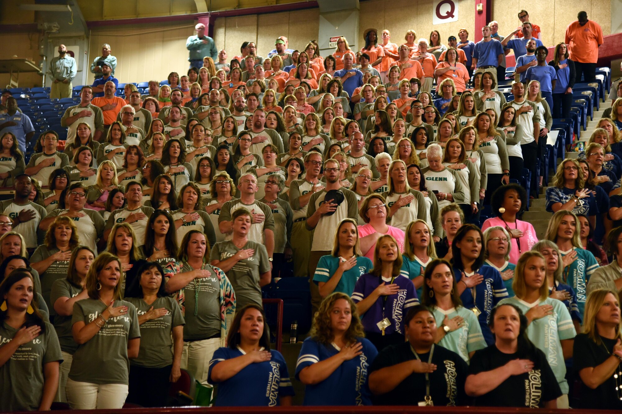 Faculty and staff from the San Angelo Independent School District recite the Pledge of Allegiance at the annual convocation signifying the kickoff of the 2017-2018 school year at the Foster Communications Colosseum, San Angelo, Texas, Aug. 15, 2017.