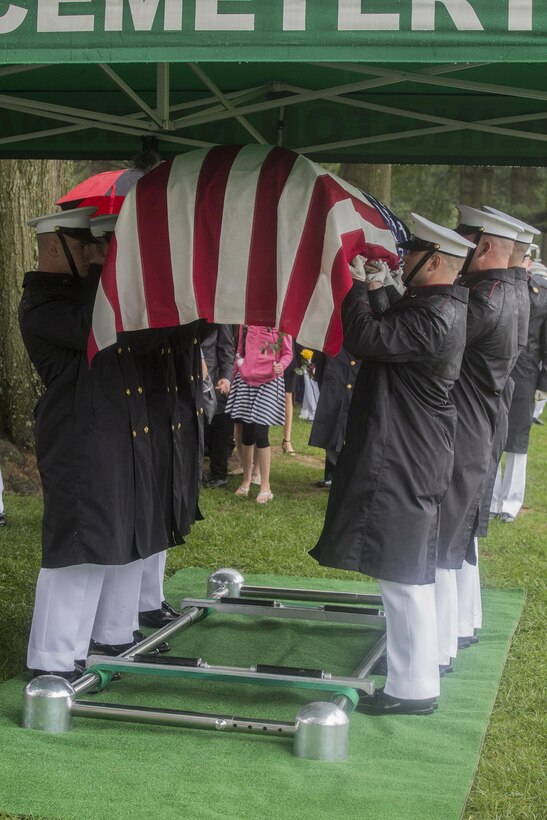 Marine Corps Body Bearers with Bravo Company, Marine Barracks Washington D.C., conduct one final raise of the casket before letting it down during a funeral for Marine Sgt. Joseph J. Murray at Arlington National Cemetery, Arlington, Va., Aug. 15, 2017. Murray, 26, was one of the 15 Marines and one Navy sailor who perished when their KC130-T Hercules crashed in Mississippi, July 10, 2017. Murray was a Critical Skills Operator with the 2nd Raider Battalion, Marine Corps Forces Special Operations Command (MARSOC). The Body Bearers execute a final ceremonial raise of the casket to eye-level for ten seconds as a sign of respect and one last render of honor to the fallen Marine. (Official U.S. Marine Corps photo by Cpl. Robert Knapp/Released)