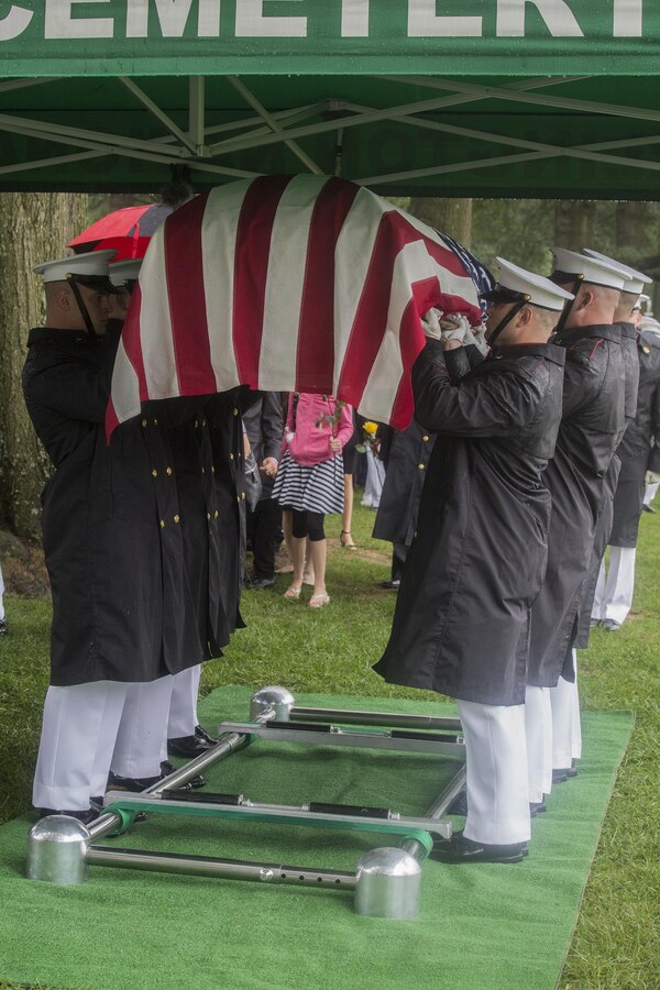 Marine Corps Body Bearers with Bravo Company, Marine Barracks Washington D.C., conduct one final raise of the casket before letting it down during a funeral for Marine Sgt. Joseph J. Murray at Arlington National Cemetery, Arlington, Va., Aug. 15, 2017. Murray, 26, was one of the 15 Marines and one Navy sailor who perished when their KC130-T Hercules crashed in Mississippi, July 10, 2017. Murray was a Critical Skills Operator with the 2nd Raider Battalion, Marine Corps Forces Special Operations Command (MARSOC). The Body Bearers execute a final ceremonial raise of the casket to eye-level for ten seconds as a sign of respect and one last render of honor to the fallen Marine. (Official U.S. Marine Corps photo by Cpl. Robert Knapp/Released)