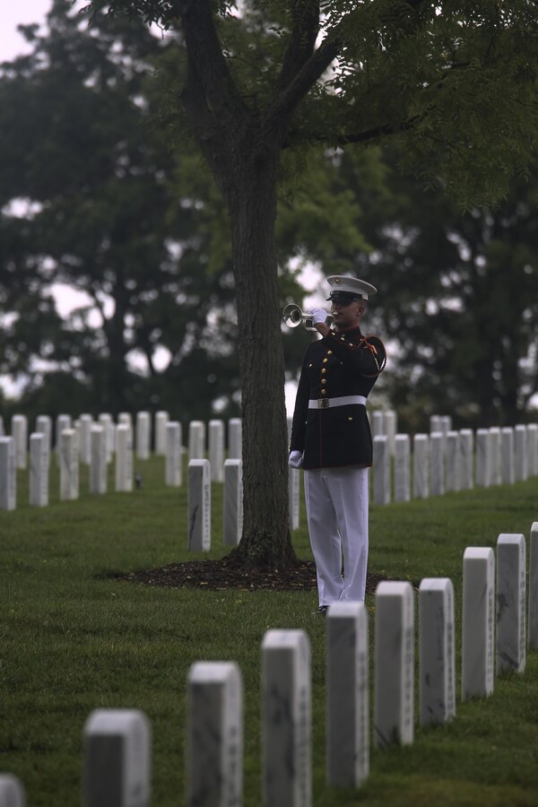 A bugler with “The Commandant’s Own” U.S. Marine Drum & Bugle Corps plays Taps following the three-volley salute during a funeral for Marine Sgt. Talon R. Leach at Arlington National Cemetery, Arlington, Va., Aug. 15, 2017. Leach, 27, was one of the 15 Marines and one Navy sailor who perished when their KC130-T Hercules crashed in Mississippi, July 10, 2017. Leach was a Critical Skills Operator with the 2nd Raider Battalion, Marine Corps Forces Special Operations Command (MARSOC). (Official U.S. Marine Corps photo by Lance Cpl. Damon McLean/Released)