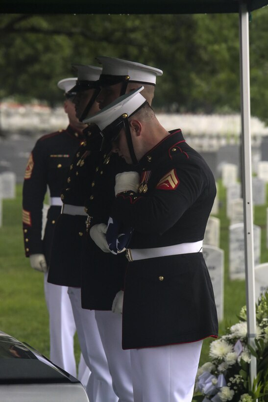 Corporal Jacob R. Heisler, Body Bearer, Bravo Company, Marine Barracks Washington D.C., conducts one final fold of the National Ensign during a funeral for Marine Sgt. Talon R. Leach at Arlington National Cemetery, Arlington, Va., Aug. 15, 2017. Leach, 27, was one of the 15 Marines and one Navy sailor who perished when their KC130-T Hercules crashed in Mississippi, July 10, 2017. Leach was a Critical Skills Operator with the 2nd Raider Battalion, Marine Corps Forces Special Operations Command (MARSOC). (Official U.S. Marine Corps photo by Lance Cpl. Damon McLean/Released)
