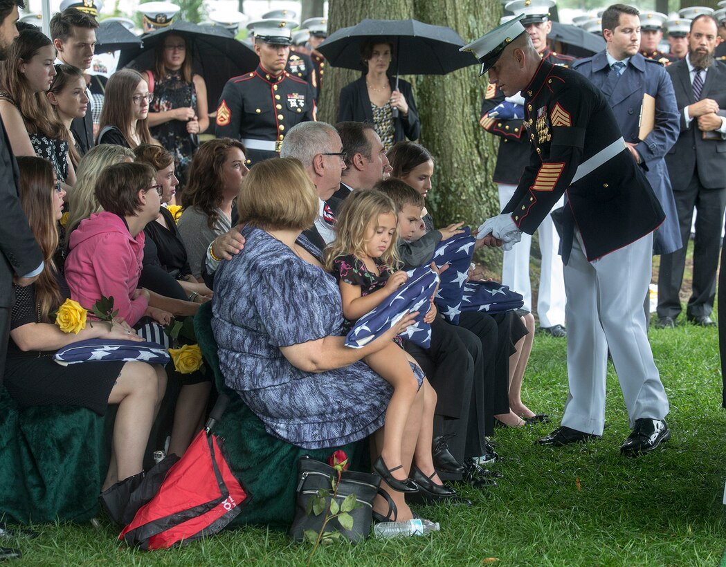Sergeant Maj. Matthew R. Hackett, command sergeant major, Marine Barracks Washington D.C., shakes hands with family members of Marine Sgt. Joseph J. Murray during a funeral for Murray at Arlington National Cemetery, Arlington, Va., Aug. 15, 2017. Murray, 26, was one of the 15 Marines and one Navy sailor who perished when their KC130-T Hercules crashed in Mississippi, July 10, 2017. Murray was a Critical Skills Operator with the 2nd Raider Battalion, Marine Corps Forces Special Operations Command (MARSOC). (Official U.S. Marine Corps photo by Cpl. Robert Knapp/Released)