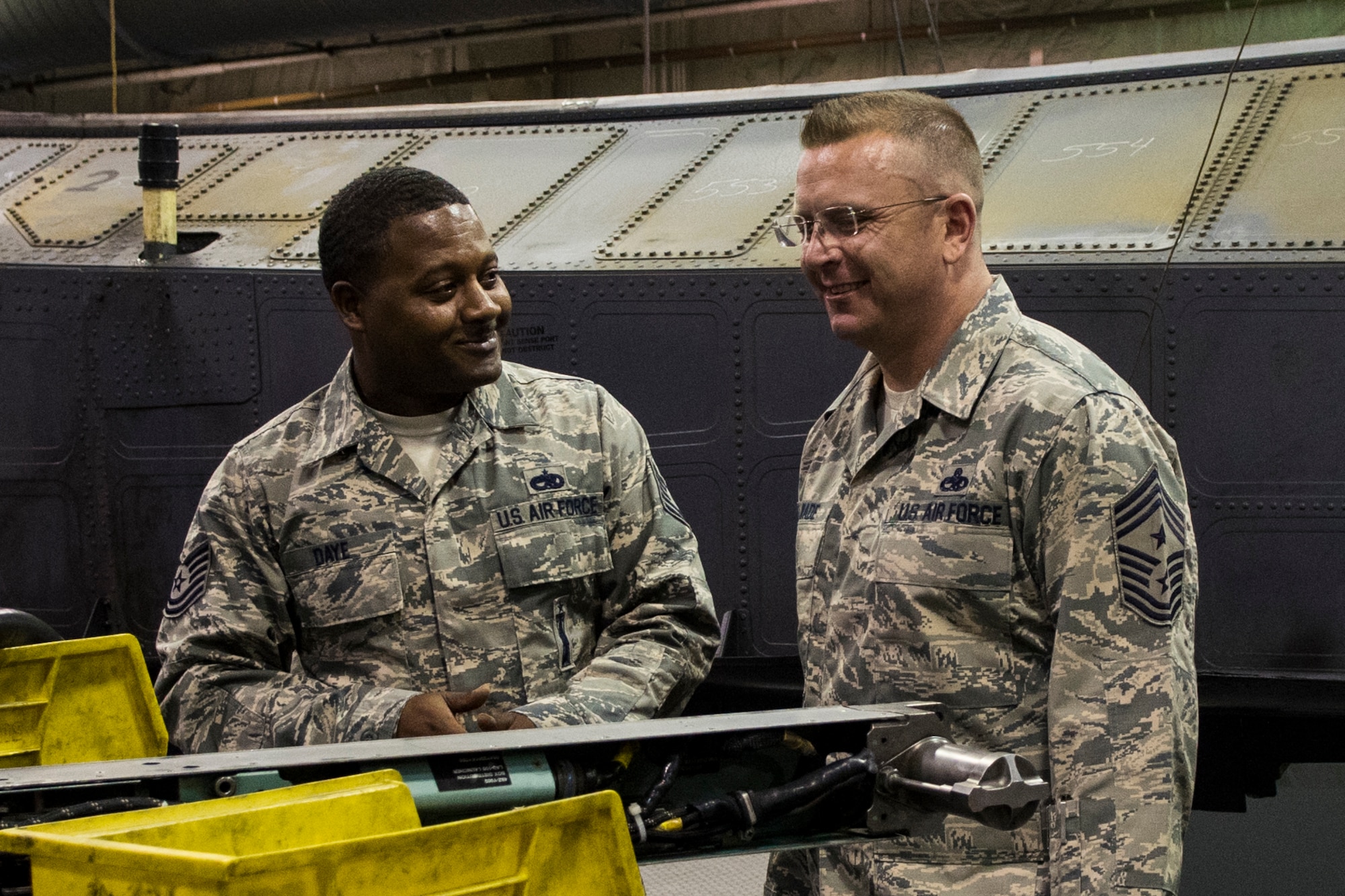 U.S. Air Force Tech. Sgt. Darron Daye, left, 4th Equipment Maintenance Squadron armament maintenance floor supervisor, describes maintenance operations to Chief Master Sgt. David Wade, 9th Air Force command chief, Aug. 14, 2017, at Seymour Johnson Air Force Base, N.C. Wade visited various 4th Maintenance Group flights and spoke with Airmen about their mission to support dominant Strike Eagle airpower. (U.S. Air Force photo by Airman 1st Class Shawna L. Keyes)