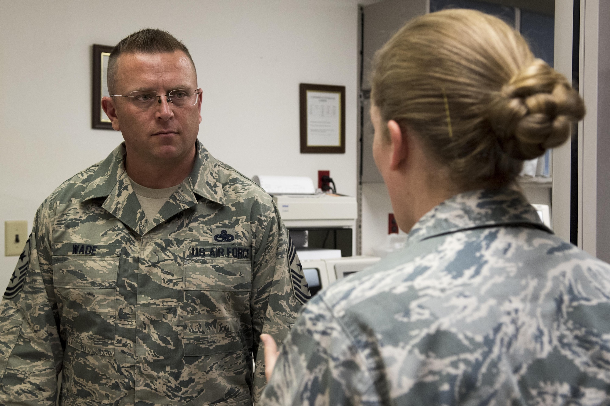 U.S. Air Force Chief Master Sgt. David Wade, left, 9th Air Force command chief, visits the 4th Medical Support Squadron laboratory and speaks with Staff Sgt. Erin Holmquist, 4th MDSS NCO in-charge of hematology, Aug. 14, 2017, at Seymour Johnson Air Force Base, N.C. Wade visited various 4th Medical Group flights and spoke with Airmen about their mission to provide health care to those supporting Strike Eagle airpower. (U.S. Air Force photo by Airman 1st Class Shawna L. Keyes)