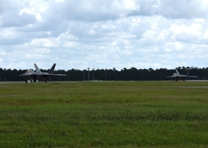 A pair of 95th Fighter Squadron F-22 Raptors from Tyndall Air Force Base, Fla., taxi down the flightline at Moody Air Force Base, Ga., during a forward area refueling point operation in conjunction with exercise Stealth Guardian Aug. 10, 2017. The inaugural exercise Stealth Guardian is designed to demonstrate the Air Force’s ability to quickly deploy F-22 assets at a moment’s notice while showcasing the ability to establish flying operations in combat or contingency environments.