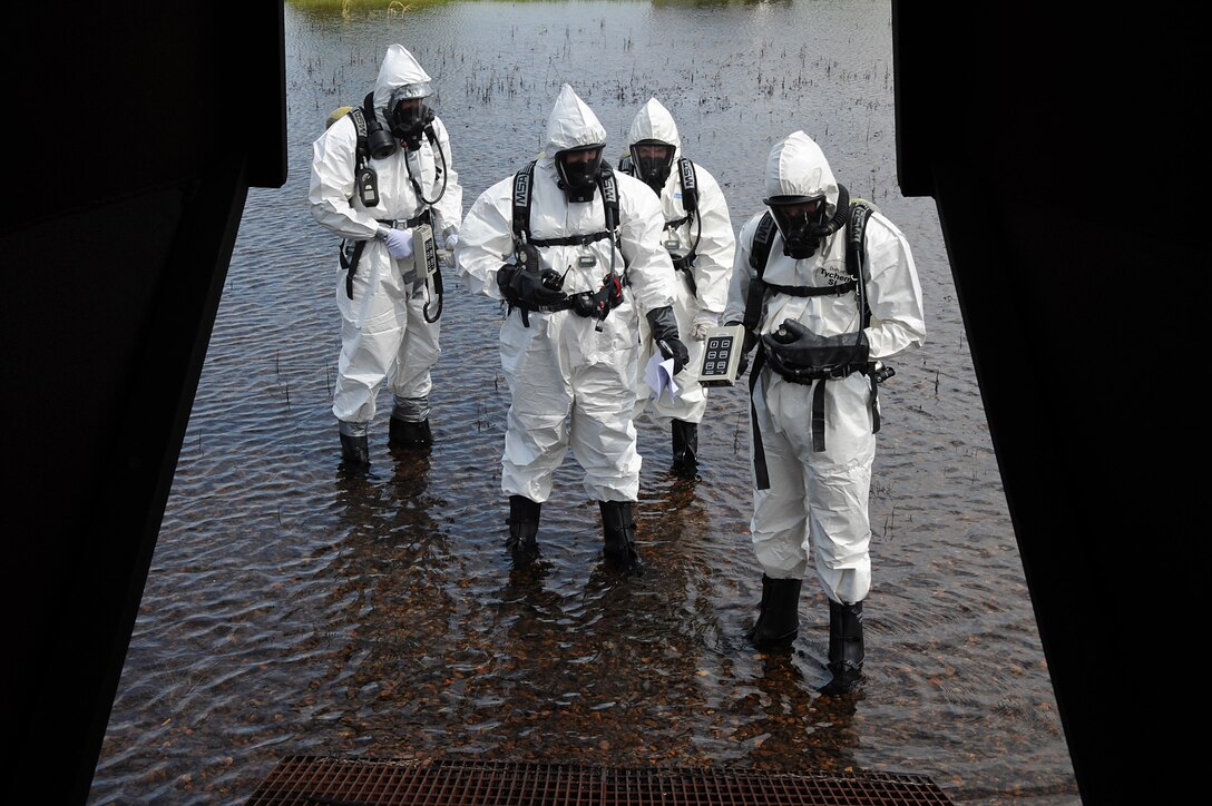 U.S. Air Force Explosives Ordinance Disposal Airmen participate in a simulated unexploded ordnance evaluation training during Operation Llama Fury 3.0 at Joint Base Langley-Eustis, Va., Aug. 9, 2017. Seven different bases from three different Air Force major commands, as well as the Norfolk, Va., bomb squad, attended the five-day training which honed in on techniques that are evaluated on a monthly and yearly basis to maintain skill levels (U.S. Air Force photo/Staff Sgt. Brittany E. N. Murphy)