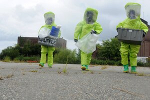 U.S. Air Force Explosives Ordinance Disposal Airmen participate in a simulated unexploded ordnance evaluation training during Operation Llama Fury 3.0 at Joint Base Langley-Eustis, Va., Aug. 8, 2017. The five-day event aimed to standardize EOD training and evaluations through a variety of simulated scenarios. (U.S. Air Force photo/Staff Sgt. Brittany E. N. Murphy)