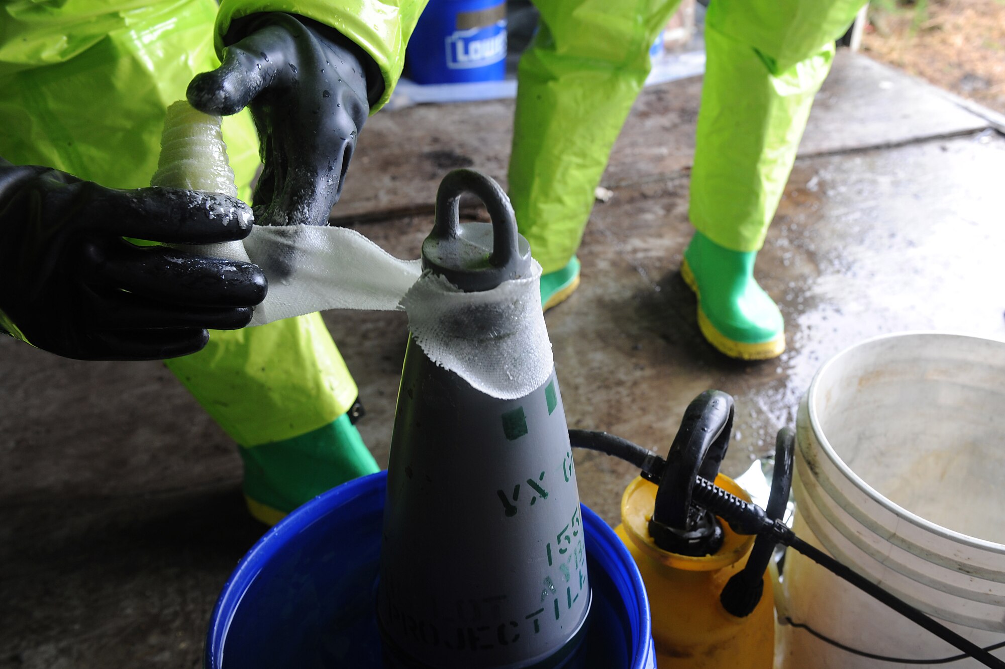 U.S. Air Force Explosives Ordinance Disposal Airmen participate in a simulated unexploded ordnance evaluation training during Operation Llama Fury 3.0 at Joint Base Langley-Eustis, Va., Aug. 8, 2017. Each team was evaluated by a subject matter expert from a different base, so that the training would be unbiased. (U.S. Air Force photo/Staff Sgt. Brittany E. N. Murphy)