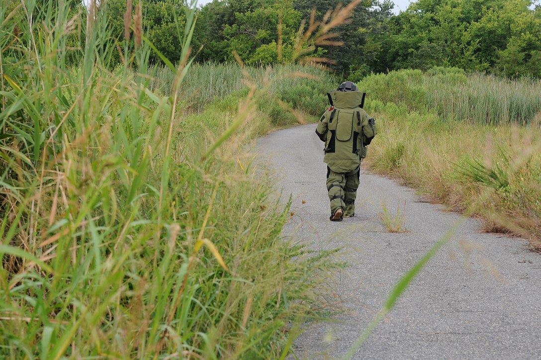 U.S. Air Force Tech. Sgt. Marc Rowand-Donohue, 633rd Civil Engineer Squadron Explosives Ordinance Disposal team lead, participate in a simulated improvised explosive device evaluation training during Operation Llama Fury 3.0 at Joint Base Langley-Eustis, Va., Aug. 9, 2017. Each three-man team had to properly disarm an IED, while also following proper protocol with other supporting agencies. (U.S. Air Force photo/Staff Sgt. Brittany E. N. Murphy)