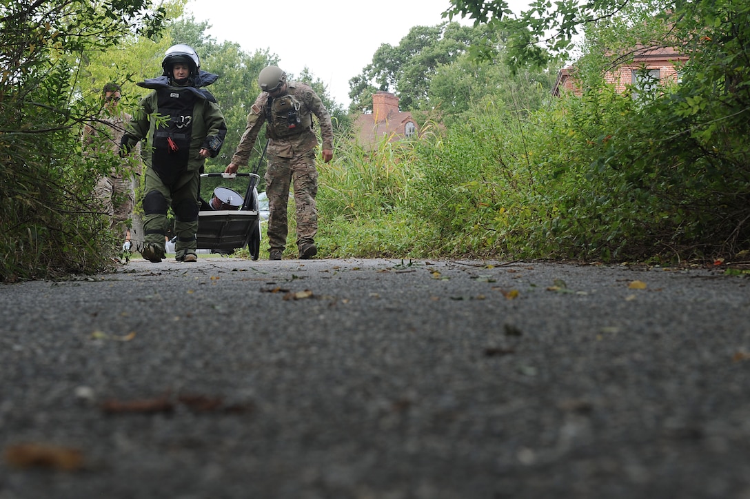 U.S. Air Force Tech. Sgt. Marc Rowand-Donohue, 633rd Civil Engineer Squadron Explosives Ordinance Disposal team lead and Senior Airman Christopher Armantrout, 633rd Civil Engineer Squadron Explosives Ordinance Disposal team member, participate in a simulated improvised explosive device evaluation training during Operation Llama Fury 3.0 at Joint Base Langley-Eustis, Va., Aug. 9, 2017. The five-day event aimed to standardize EOD training and evaluations and included teams from seven Air Force Bases across the east coast. (U.S. Air Force photo/Staff Sgt. Brittany E. N. Murphy)