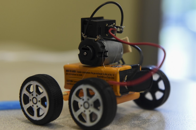 Kids from the ages of 10 to 18 built makeshift cars with a battery, wooden sticks, wheels, straws, wires and a tiny motor during a Science, Technology, Engineering and Mathematics event at the Chapel Annex in Joint Base Charleston, S.C., Aug. 14.