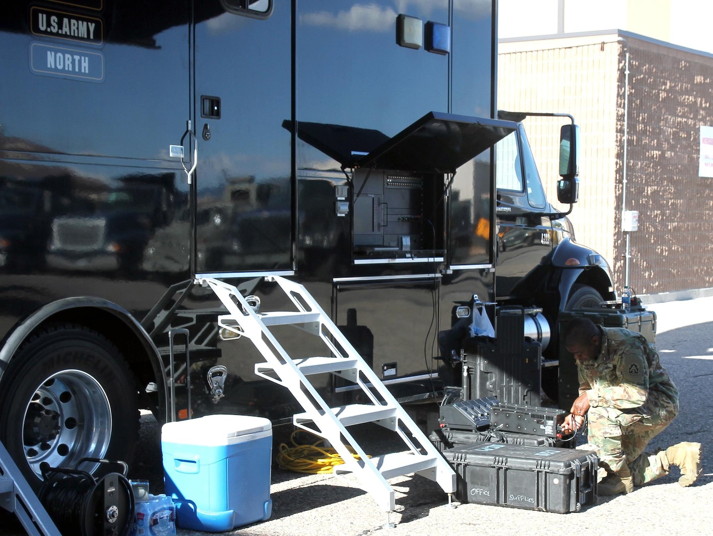 Sgt. 1st Class Jason Roseburgh, a signal support systems specialist with Task Force 51, U.S. Army North, performs mission checks on signal equipment outside the Sentinel vehicle at Kirkland Air Base in Albuquerque, N.M., during exercise Vigilant Guard 17-04 Aug. 3-11.