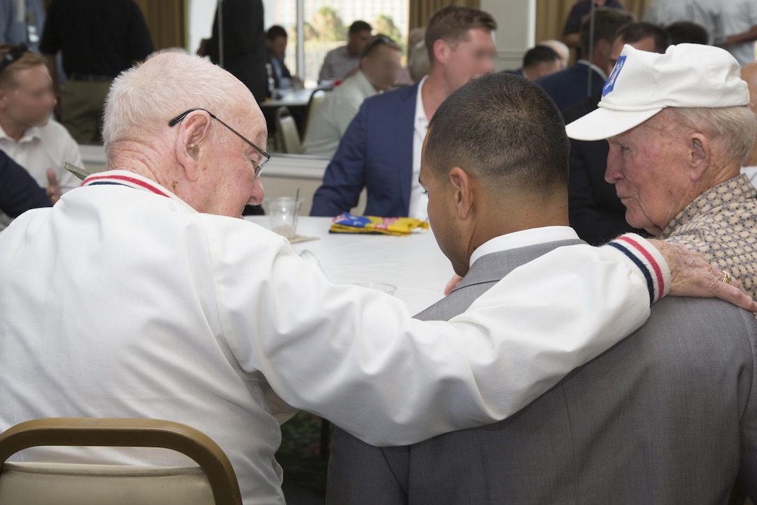 Archie B. Rackerby, a World War II Marine Raider, talks with a Marine from 1st Marine Raider Battalion, U.S. Marine Corps Forces, Special Operations Command during the 2017 Marine Raider Association Reunion in San Diego, Aug. 11. A Raider-to-Raider event was held to allow 17 World War II veterans to connect with Raiders of today, sharing stories, history, knowledge and experiences in a way that is only possible through the shared experience of war. (U.S. Marine Corps photo by Sgt. Salvador R. Moreno, released)