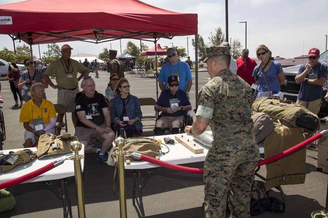 The kennel master with 1st Marine Raider Battalion, U.S. Marine Corps Forces, Special Operations Command, demonstrates MARSOC’s canine capabilities during the 2017 Marine Raider Association Reunion and Gold Star family day aboard Camp Pendleton, Calif., Aug. 11. First MRB participated in the annual event by hosting the World War II Raiders and Gold Star families at 1st MRB’s headquarters with static displays and demonstrations of equipment, tools and weapons used by the Raiders of today. (U.S. Marine Corps photo by Sgt. Salvador R. Moreno, released)