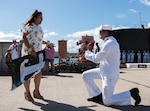 STS2 (SS) Robert C Deboer proposes to his now fiance after the Los Angeles-class attack submarine USS Santa Fe (SSN-763) made its homecoming arrival at Joint Base Pearl Harbor-Hickam, after completing its latest deployment, Aug. 15.