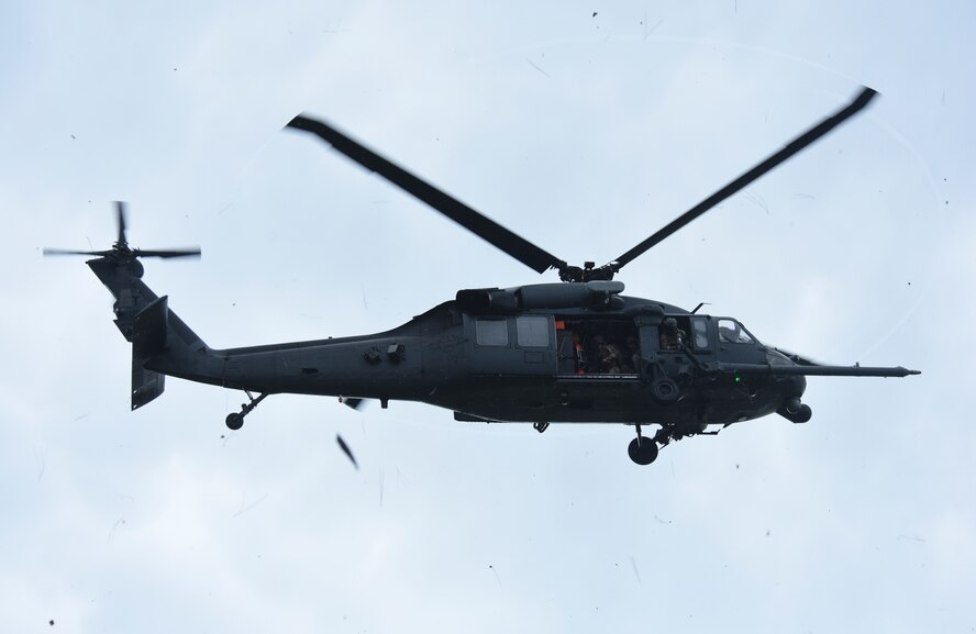 A U.S. Air Force HH-60G Pave Hawk helicopter from Moody Air Force Base, Ga., hovers overhead before landing in a wooded area near Tyndall Air Force Base, Fla., during exercise Stealth Guardian Aug. 8, 2017.