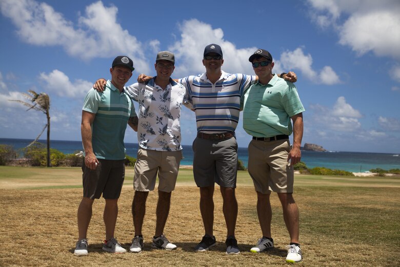Competitors pose for a picture during the Commander’s Cup golf tournament at the Kaneohe Klipper Golf Course, Marine Corps Base Hawaii, Aug. 11, 2017. The tournament, hosted by Marine Corps Community Services and JN Automotive Group, was open to all service members, Department of Defense employees, civilians and guests sponsored by authorized patrons. Prizes were given out to first through eighth place contestants, and various raffles with prizes were given away. (U.S. Marine Corps photo by Lance Cpl. Matthew Kirk)