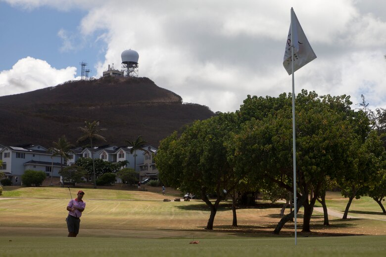 A golfer hits a ball during the Commander’s Cup golf tournament at the Kaneohe Klipper Golf Course, Marine Corps Base Hawaii, Aug. 11, 2017. The tournament, hosted by Marine Corps Community Services and JN Automotive Group, was open to all service members, Department of Defense employees, civilians and guests sponsored by authorized patrons. Prizes were given out to first through eighth place contestants, and various raffles with prizes were given away. (U.S. Marine Corps photo by Lance Cpl. Matthew Kirk)