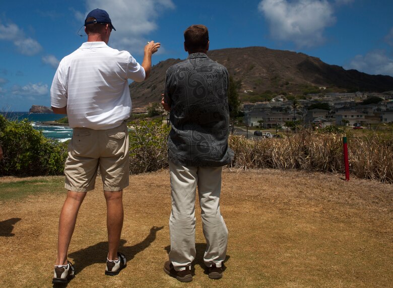 Col. Michael Styskal, the commanding officer of 3rd Marine Regiment, and Bruce Jenkins, the director of military client services for JN Automotive Group, talk to each other during the Commander’s Cup golf tournament at the Kaneohe Klipper Golf Course, Marine Corps Base Hawaii, Aug. 11, 2017. The tournament, hosted by Marine Corps Community Services and JN Automotive Group, was open to all service members, Department of Defense employees, civilians and guests sponsored by authorized patrons. Prizes were given out to first through eighth place contestants, and various raffles with prizes were given away. (U.S. Marine Corps photo by Lance Cpl. Matthew Kirk)
