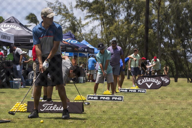 Residents of Marine Corps Base Hawaii play golf during the Klipper Summer Bash at the Klipper Golf Course aboard MCB Hawaii, July 28, 2017. The Summer Bash is an annual event hosted by the Klipper Golf Course to strengthen a sense of community amongst residents of MCB Hawaii. (U.S. Marine Corps photo by Lance Cpl. Isabelo Tabanguil)