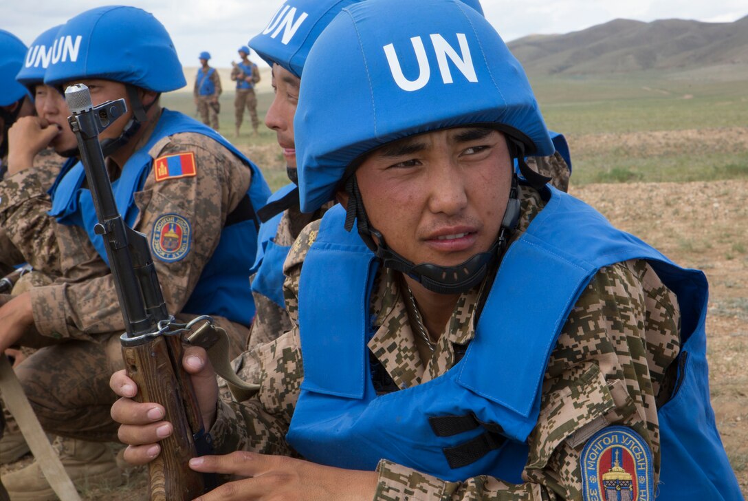 Sgt. Lkhagvadorj, a soldier in the Mongolian Armed Forces, rests after a practical application of tactical combat casualty care during Exercise Khaan Quest 2017 at Five Hills Training Area, Mongolia, July 24, 2017. Khaan Quest 2017 is a Mongolian-hosted, combined, joint training exercise designed to strengthen the capabilities of the U.S., Mongolia and other partner nations in international peacekeeping operations. (U.S. Marine Corps photo by Lance Cpl. Charles Plouffe)