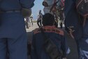 Local firefighters observe Shimajiri Kenichi, Kadena Fire Emergency Service fire inspector, as he explains danger zones on an F-15 Eagle during annual hands-on fire training August 14, 2017, at Kadena Air Base, Japan. More than 50 local firefighters visited to observe how Kadena's firefighters respond during an emergency. (U.S. Air Force photo/ Airman 1st Class Greg Erwin)