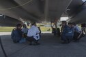 Shimajiri Kenichi, Kadena Fire Emergency Service fire inspector, explains dangers involved with fighting aircraft fires during annual hands-on fire training August 14, 2017, at Kadena Air Base, Japan. Local firefighters gained better understanding of Kadena's fire emergency service capabilities, missions and operations during the hands-on training. (U.S. Air Force photo/ Airman 1st Class Greg Erwin)
