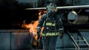 A firefighter from the 18th Civil Engineer Squadron goes back for another hose during annual hands-on fire training August 14, 2017, at Kadena Air Base, Japan. Okinawan firefighters conduct live fire training annually with 18th CES firefighters to help maintain readiness for Team Kadena and Okinawa in case of emergencies. (U.S. Air Force photo/ Airman 1st Class Greg Erwin)