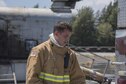 U.S. Air Force Senior Airman Keith Brown, 18th Civil Engineer Squadron firefighter, takes off his gear after annual hands-on fire training August 14, 2017, at Kadena Air Base, Japan. Okinawan firefighters conduct live fire training annually with 18th CES firefighters to help maintain readiness for Team Kadena and Okinawa in case of emergencies. (U.S. Air Force photo/ Airman 1st Class Greg Erwin)