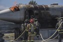 U.S. Air Force 18th Civil Engineer Squadron firefighters conduct annual hands-on fire training August 14, 2017, at Kadena Air Base, Japan. Okinawan firefighters conduct live fire training annually with 18th CES firefighters to help maintain readiness for Team Kadena and Okinawa in case of emergencies. (U.S. Air Force photo/ Airman 1st Class Greg Erwin)