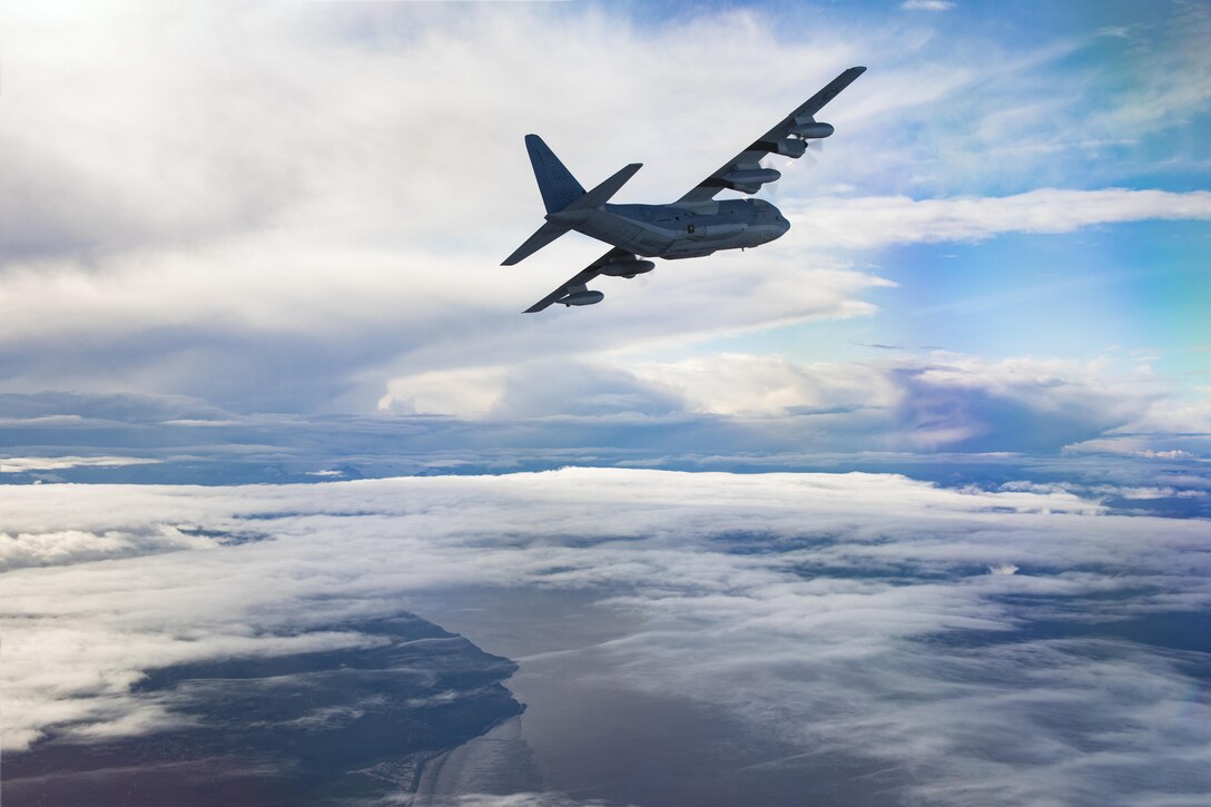 A U.S. Marine Corps KC-130J with Marine Aerial Refueler Transport Squadron (VMGR) 152, conducts formation flights