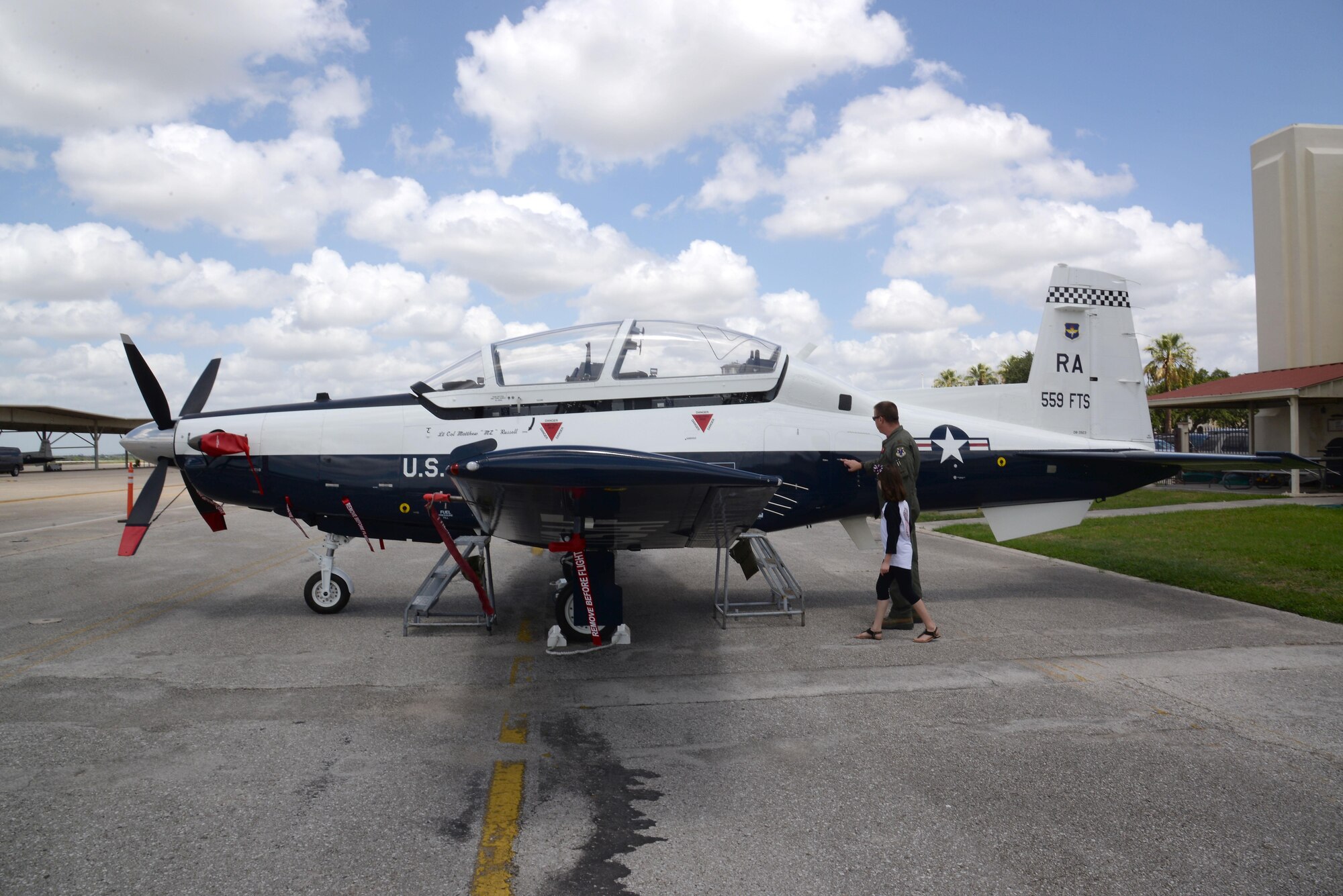 Airmen with the 559th Flying Training Squadron welcomed younger family members to Hangar 64 on Joint Base San Antonio-Randolph for Bring Your Child to Work Day August. 11.