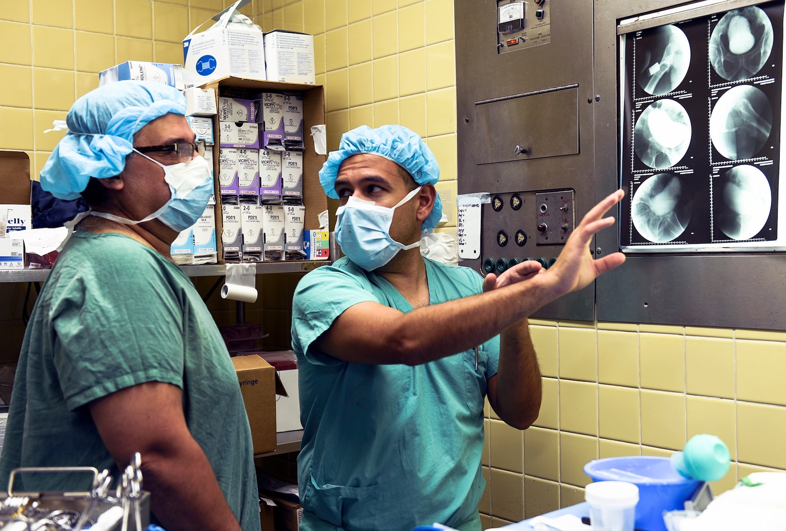 Maj. (Dr.) Humberto Villarreal, Brooke Army Medical Center urologist analyzes an X-ray with his Honduran counterpart at Hospital Escuela. A team of U.S. Army medical personnel from Brooke Army Medical Center participated in a training exercise in Hospital Escuela and Hospital Maria in Tegucigalpa, Honduras from July 19 – 27, performing complex trauma surgical procedures in a resource limited environment with logistical support from Joint Task Force-Bravo.