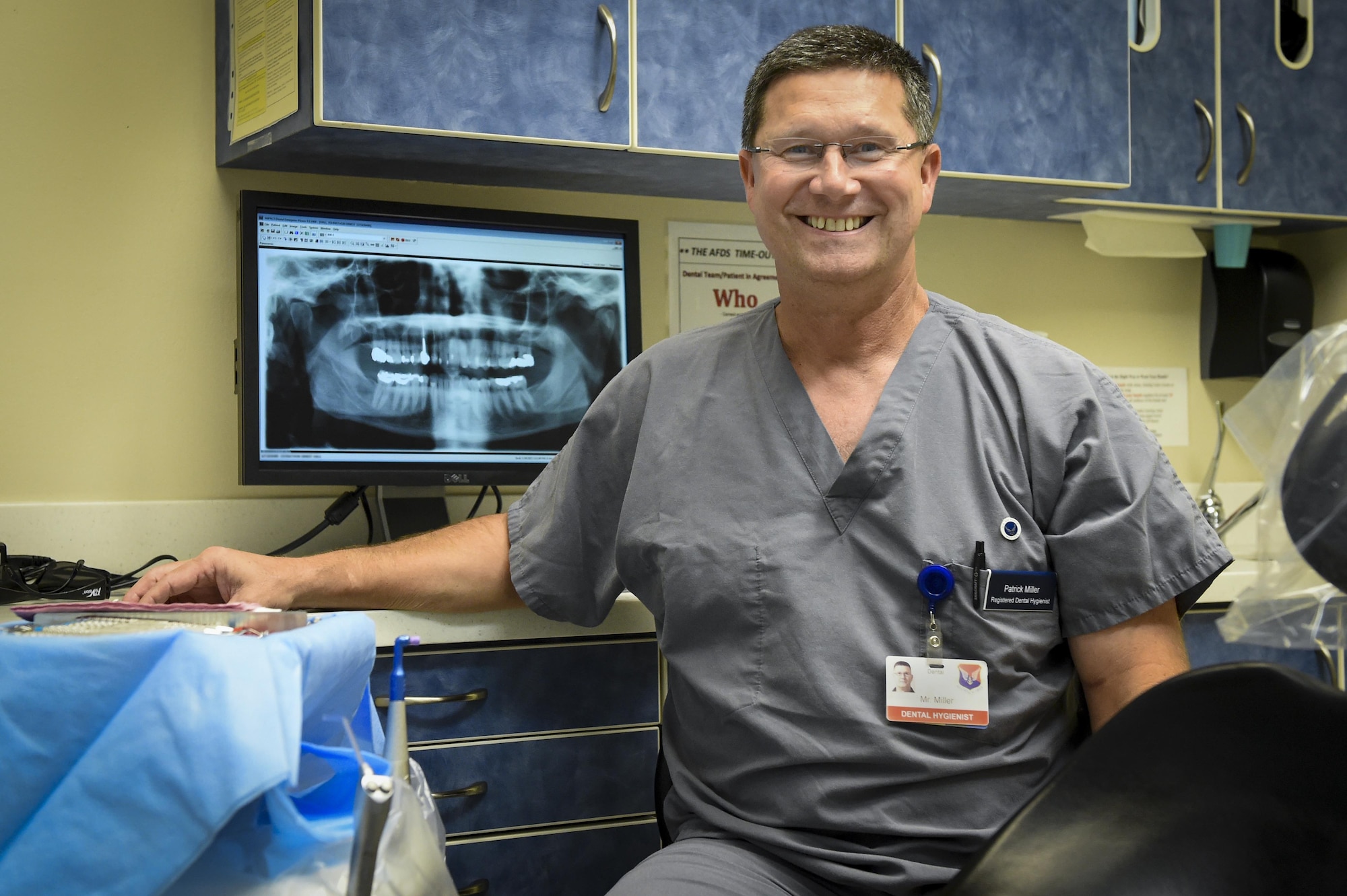 Patrick Miller, 628th Medical Group chief of preventative dentistry, dental hygienist, sits in an exam room at the Deily Dental Clinic on Joint Base Charleston, South Carolina, Aug. 1.