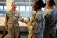 Maj. Randall Jamieson, 42nd Air Base Wing deputy wing chaplain, hands a box of coffee to an Airman at the Maxwell Clinic, Aug. 8, 2017. The coffee was donated by Holy Joe’s Café, a non-profit organization that donates coffee to chaplains. Holy Joe’s Café has donated more than 50 pallets of coffee and cookies to Maxwell so far this year. (U.S. Air Force photo/Senior Airman Tammie Ramsouer)