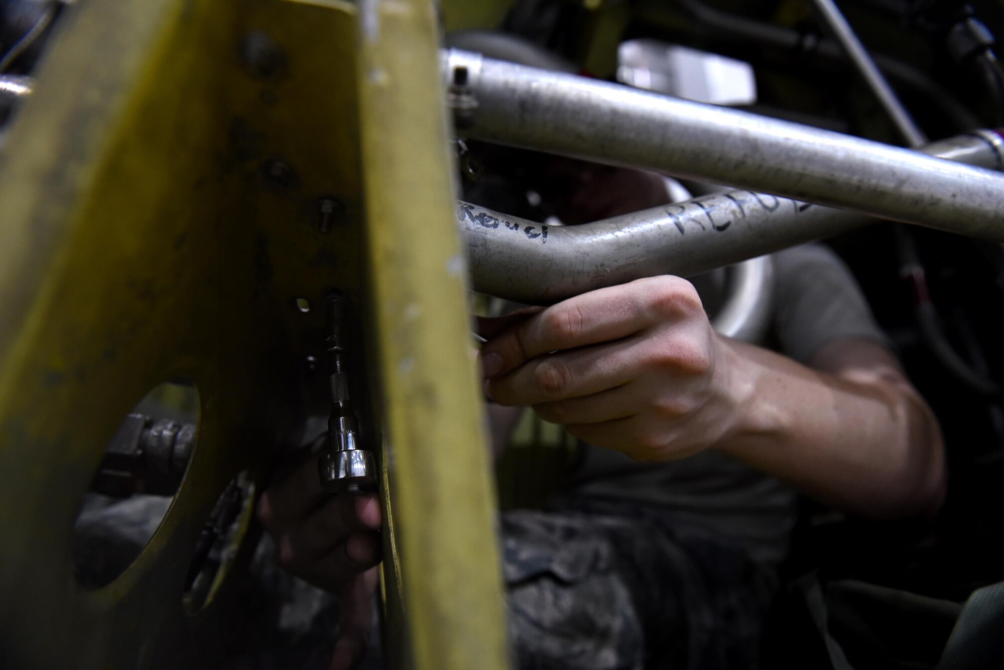 Airman Tyler Bartels, 19th Maintenance Squadron fuel systems apprentice, tightens a bolt on a C-130J fuel tank Aug. 14, 2017, at Little Rock Air Force Base, Ark. Fuels Airmen enter confined spaces less than two feet in circumference to diagnose malfunctions, seal and maintain components of the fuel tank. (U.S. Air Force photo by Airman 1st Class Kevin Sommer Giron)