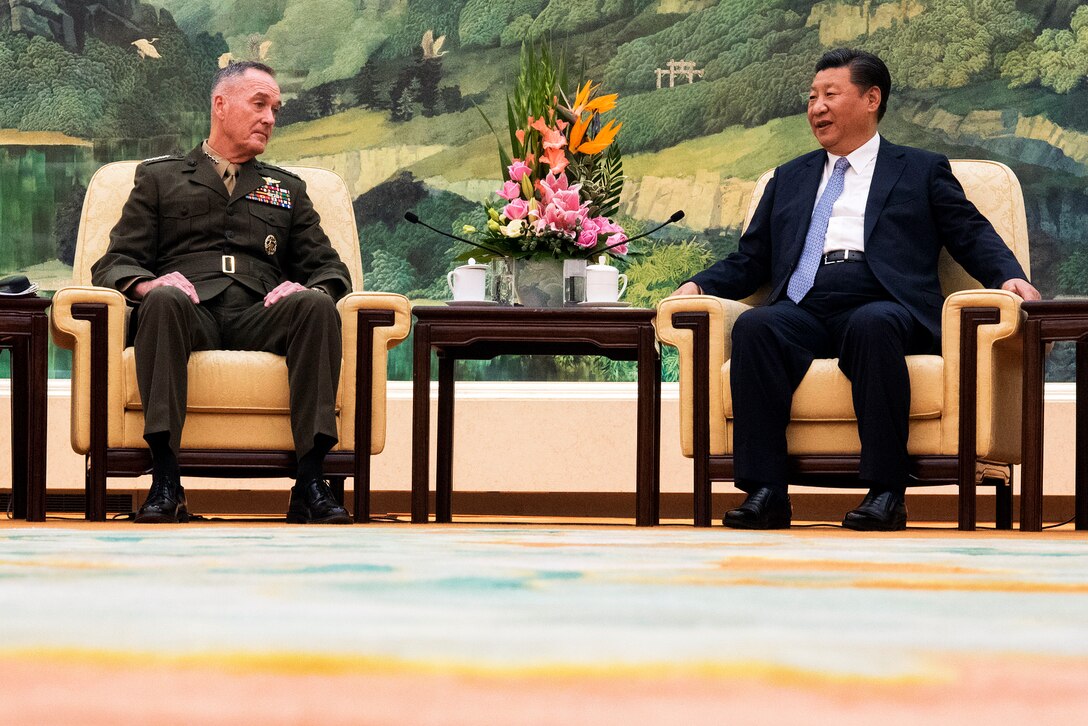 Two leaders talk during a meeting in Beijing, China.