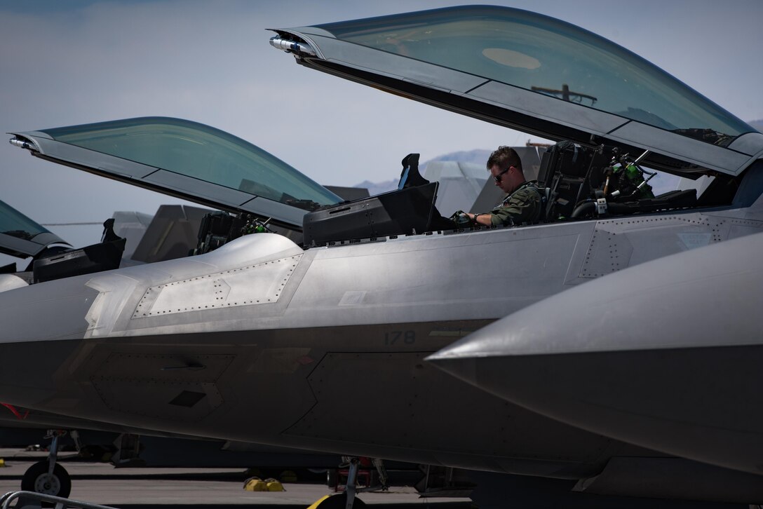 U.S. Air Force Capt. Flash, F-22 Raptor pilot, prepares to start engines during the first flight of Red Flag 17-4 at Nellis Air Force Base, Nev., Aug. 14, 2017. Red Flag is a realistic combat training exercise involving the air, space and cyber forces of the United States and its allies. (U.S. Air Force photo/Staff Sgt. Carlin Leslie)