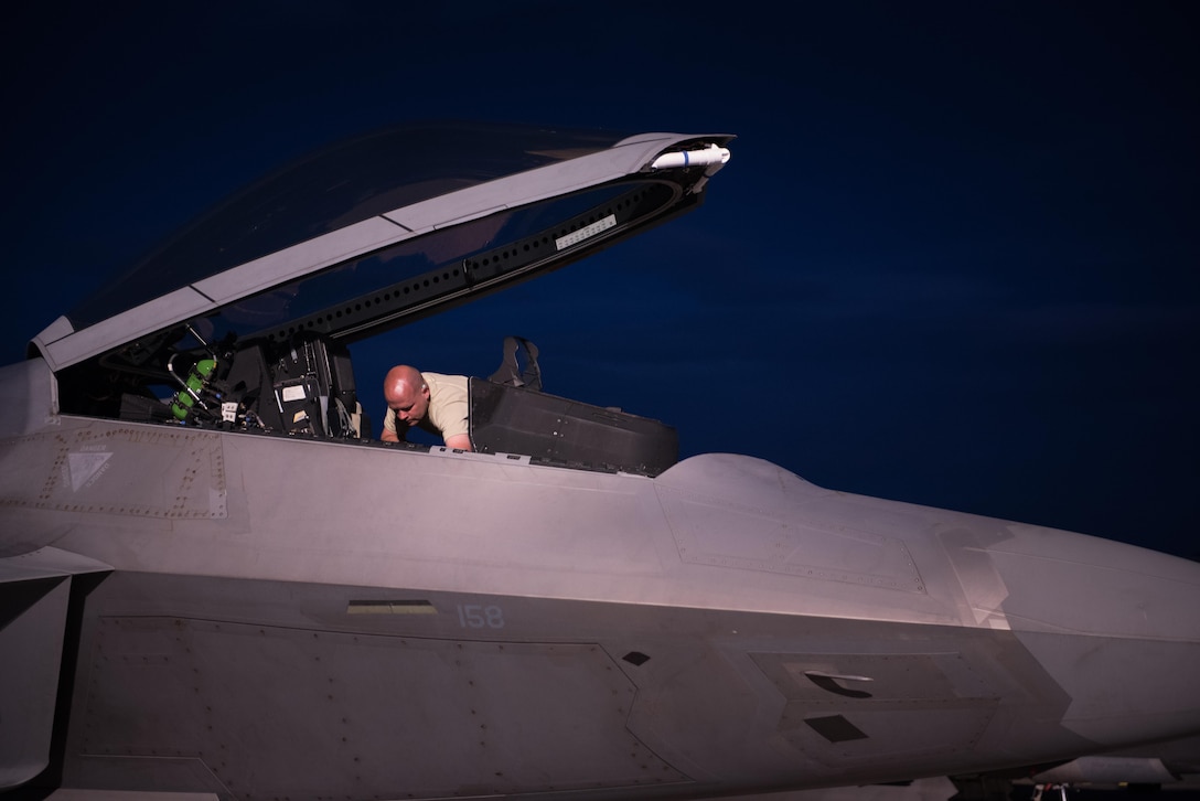 U.S. Air Force Staff Sgt. Courtney Puyear, 94th Aircraft Maintenance Unit crew chief, inspects the cockpit of an 94th Fighter Squadron F-22 Raptor, during Red Flag 17-4 at Nellis Air Force Base, Nev., Aug. 14, 2017. (U.S. Air Force Photo/Staff Sgt. Carlin Leslie)