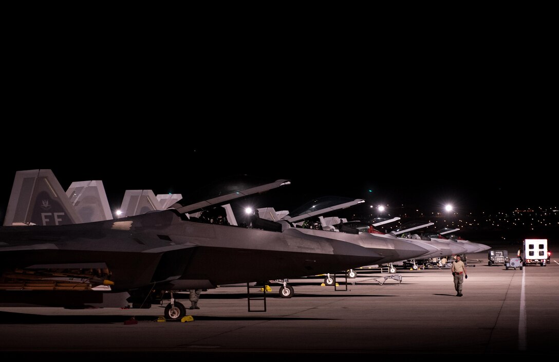 U.S. Air Force F-22 Raptors from 94th Fighter Squadron prepare to launch at Nellis Air Force Base, Nev., Aug.  14, 2017.  The aircraft are assigned to Joint Base Langley-Eustis Air Force Base, Va.’s, 1st Fighter Wing and will conduct air combat training sorties with various aircraft during Red Flag 17-4, running from Aug. 14 to 25. (U.S. Air Force Photo/Staff Sgt. Carlin Leslie)