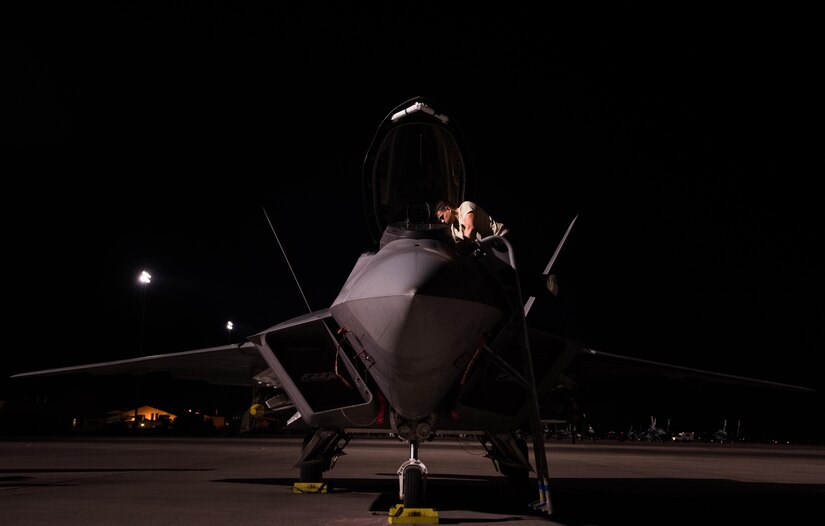 U.S. Air Force Juan Luna, 94th Aircraft Maintenance Unit crew chief, inspects the cockpit of an F-22 Raptor prior to launch for Red Flag 17-4 at Nellis Air Force Base, Nev., August 14, 2017. The aircraft is assigned to Joint Base Langley-Eustis, Va.’s, 1st Fighter Wing and will conduct air combat training sorties with various aircraft during Red Flag 17-4, running from Aug. 14 to 25. (U.S. Air Force Photo/Staff Sgt. Carlin Leslie)