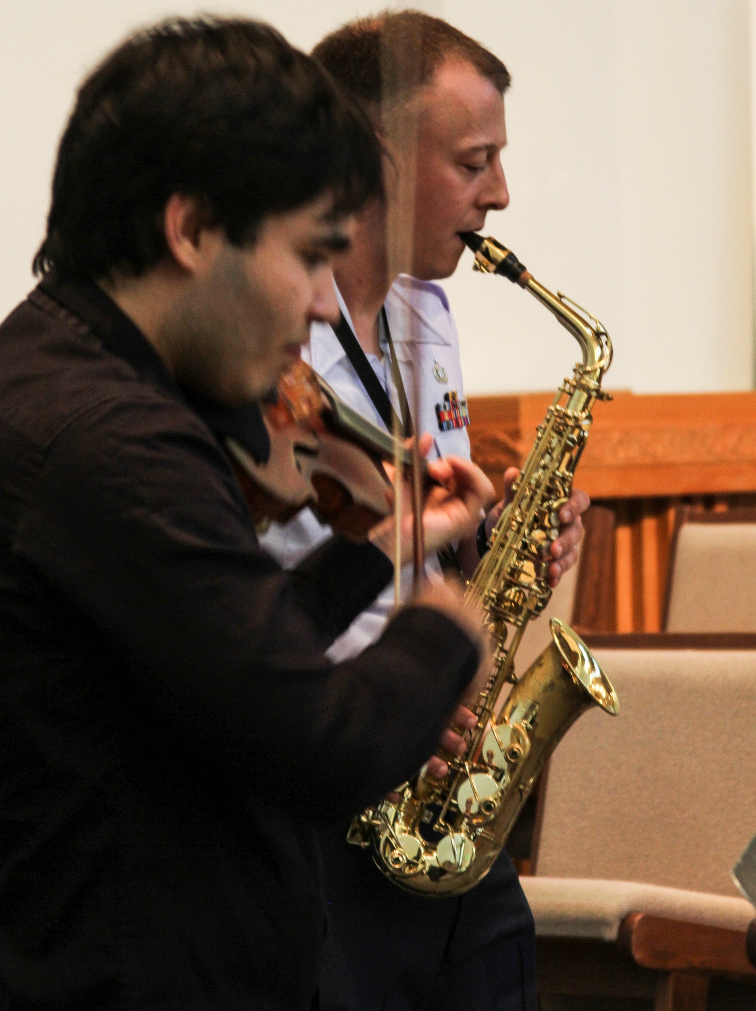 Tech. Sgt. Anthony Balester, Band of the Pacific-Hawaii saxophonist, performs with Eric Silberger, a virtuoso violinist, during the “Honoring Our Troops” concert on Joint Base Pearl Harbor-Hickam, Hawaii, Aug. 11, 2017.  The “Honoring our Troops” concert was one of the 2018 Hawaii International Music Festival’s concerts that brought a group of internationally-acclaimed musicians together in an effort to expand classical music throughout Oahu. (U.S. Air Force photo by Tech. Sgt. Heather Redman)