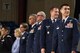 After arriving on stage U.S. Air Force Col. Ricky Mills, 17th Training Wing commander, and Col. Jeffrey Sorrell, 17th Training Wing vice commander, take a moment to greet the other guests of the annual convocation of the San Angelo Independent School District at the Foster Communications Colosseum, San Angelo, Texas, Aug. 15, 2017. The convocation recognizes the beginning of the new school year for the students and introduces the teachers, grounds keepers, custodians and other careers that it takes to make a school succeed. (U.S. Air Force photo by Airman Zachary Chapman/Released)