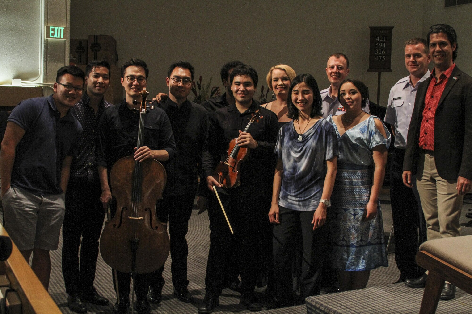 Performers from the 2018 Hawaii International Music Festival pose for a photo after the “Honoring Our Troops” concert on Joint Base Pearl Harbor-Hickam, Hawaii, Aug. 11, 2017.  The “Honoring Our Troops” concert brought a group of internationally-acclaimed musicians together in an effort to expand classical music throughout Oahu. (U.S. Air Force photo by Tech. Sgt. Heather Redman)