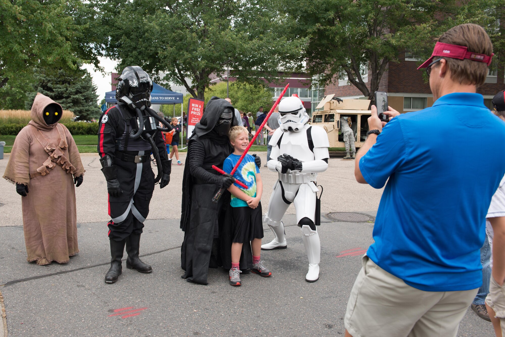 Children pose with Star Wars characters at Family Day. (Air Force Photo/Master Sgt. Eric Amidon)