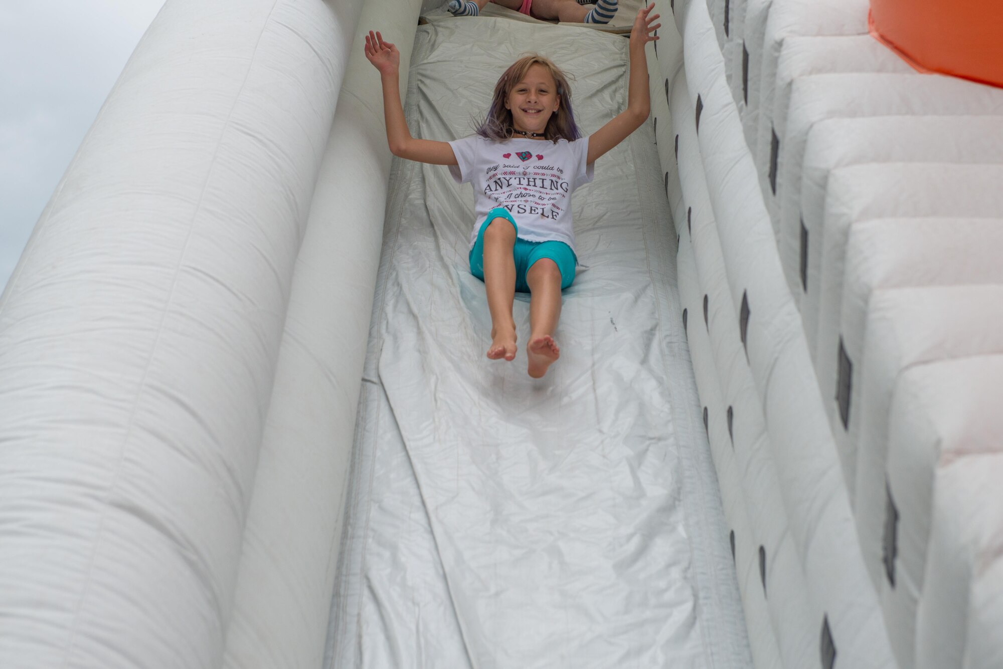 Taking on the slide at Family Day. (Air Force Photo/Master Sgt. Eric Amidon)